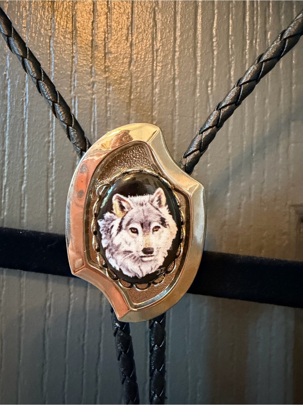 Vintage Black Leather Bolo Tie with Silver and White Wolf